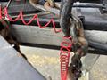 A 2005 Katolight SED60FPJ4 generator with visible rust on a chain and a red coiled cable attached to it