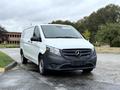 A 2020 Mercedes-Benz Metris van in white and black with a sleek design and the Mercedes logo on the front grille