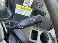 A close-up of a control lever inside a 2012 Autocar XPERT featuring settings for windshield wipers with labels for on off and intermittent functions
