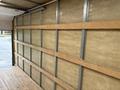 2024 Ford E-450 interior with wooden slats on the walls and a wooden floor designed for cargo transport