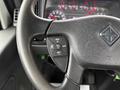 Close-up of a steering wheel with controls for cruise and other functions on a 2020 International MV607