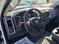 The interior of a 2014 RAM 5500 featuring a steering wheel dashboard and control panel with gauges and buttons