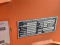 A metal identification plate for a 2009 JLG E300AJP boom lift displaying specifications and ratings