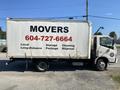 A 2014 Hino 195 box truck with the word "MOVERS" prominently displayed on the side along with a phone number and services offered