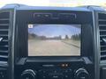 Dashboard display of a 2019 Ford F-550 showing a rearview camera view with a warning to check surroundings for safety