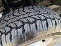 Close-up of a rugged tire tread from a 2012 Ford F-350 SD showing deep grooves and sturdy design for off-road capability