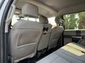 Interior view of the back seat of a 2020 Ford F-350 SD with gray cloth upholstery and headrests in an upright position