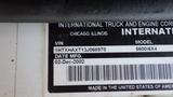 A nameplate for a 2003 International 5600i truck displaying the VIN model and manufacturing date