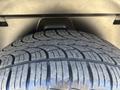 A close-up view of a treaded tire from a 2015 RAM 1500 showing detailed patterns designed for traction and grip