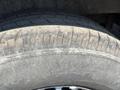 Close-up of a worn tire from a 2022 Mercedes-Benz Sprinter showing visible tread patterns and some dirt accumulation