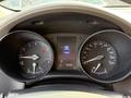 The image shows the dashboard of a 2021 Toyota C-HR featuring two circular gauges for speed and fuel along with a central display indicating the vehicle's gear and mileage