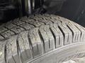 A close-up of a tire from a 2020 RAM Promaster showing the tread pattern and wear on the rubber surface