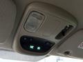 Overhead console of a 2008 Sterling Bullet featuring a light, control buttons, and a digital display showing the directional compass and temperature