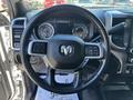 Steering wheel and dashboard of a 2021 RAM 5500 featuring controls and gauges
