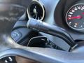A close-up view of the gear shift lever and control stalk inside a 2024 Mercedes-Benz Sprinter 2500 with a speedometer in the background