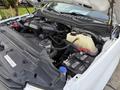 Engine compartment of a 2018 Ford F-350 showing various components including the battery and coolant reservoir