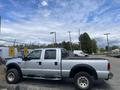A silver 2007 Ford F-350 Super Duty truck parked with a crew cab and large wheels