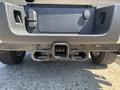 A rear view of a 2023 Ford F-350 SD showcasing the hitch receiver and mounting points for towing accessories