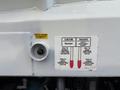 A control panel on a 2010 Autocar Xpeditor displaying instructions for an ejector and tailgate with pull and push indicators