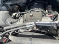 Close-up of the engine components of a 2016 RAM 5500 including hoses wires and various mechanical parts