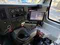 Interior dashboard of a 2020 Chevrolet Express featuring a digital display screen and various control knobs and buttons
