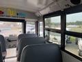 Interior view of a 2007 Freightliner B2 school bus showing empty seat rows and large windows