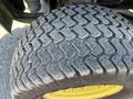 Close-up of a tire from a 2016 John Deere 1585 Terrain Cut featuring a textured tread pattern designed for improved traction on various surfaces