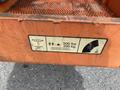 A label on a 2009 JLG E300AJP aerial lift indicating a weight capacity of 500 lbs or 230 kg with safety symbols for personnel restrictions