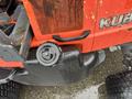 A red 2012 Kubota F3680 tractor featuring a rounded black fuel cap and sturdy black tire treads
