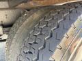 Close-up of a tire from a 2011 International 4300 showing tread patterns and rubber surface details