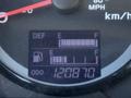 Dashboard display of a 2015 Hino 358 showing DEF level fuel gauge and odometer reading of 120870 miles