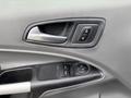 Interior door panel of a 2019 Ford Transit Connect showing door handle and control buttons for locks and windows