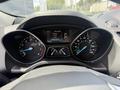Dashboard of a 2015 Ford Escape displaying speedometer and fuel gauge with digital screen showing information and temperature
