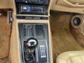Interior view of a 1970 Chevrolet Corvette showing the gear shift console with a black shift knob and a radio above it