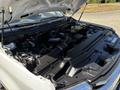 A 2020 Ford F-350 SD engine exposed with various components including the air intake hose battery and wiring visible under the hood