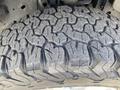 Close-up of a tire tread showing deep grooves and patterns on a 2018 Ford F-150 tire