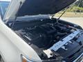 A 2017 Chevrolet Colorado with the hood open revealing the engine compartment featuring various engine components and mechanical parts