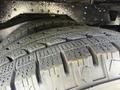 A close-up view of a tire from a 2020 Chevrolet Express showcasing detailed tread patterns and texture
