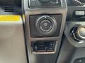 A close-up of the dashboard controls in a 2018 Ford F-150 featuring the trailer backup assist dial and additional control buttons