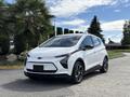 A white 2023 Chevrolet Bolt EV with a modern design featuring a sleek front grille and alloy wheels