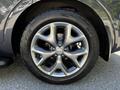 A close-up of a 2017 Kia Sorento wheel featuring a silver alloy rim and black tire with visible tread patterns