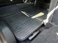 Interior view of the rear cargo area of a 2017 Kia Sorento featuring a black rubber floor mat with a textured surface