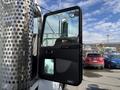 A 2008 Kenworth T370 truck with its driver-side door open displaying interior controls and door panel features