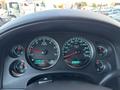 Dashboard of a 2011 Chevrolet Avalanche displaying speedometer fuel gauge odometer and temperature readings
