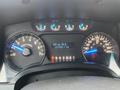 Dashboard of a 2013 Ford F-150 showing speedometer fuel gauge and trip information