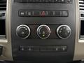 Dashboard controls of a 2012 Dodge Ram 5500 featuring climate control dials switches for towing and an auxiliary panel