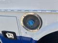 Gas cap of a 2017 Chevrolet Colorado showing a blue fill inlet surrounded by a circular metal casing