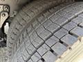 Close-up of a tire from a 1996 Kenworth T800 showing detailed tread patterns and surface wear
