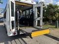 A 2018 Ford Transit-350 wheelchair accessible van with an open rear and a folding ramp extended for easy access