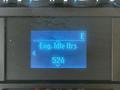 A digital display screen showing engine idle hours with the reading 524 on a blue illuminated background